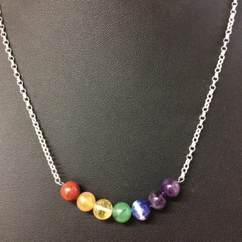 A necklace with 925 sterling silver chain and 8mm gemstone beads in the order of the colours of the rainbow