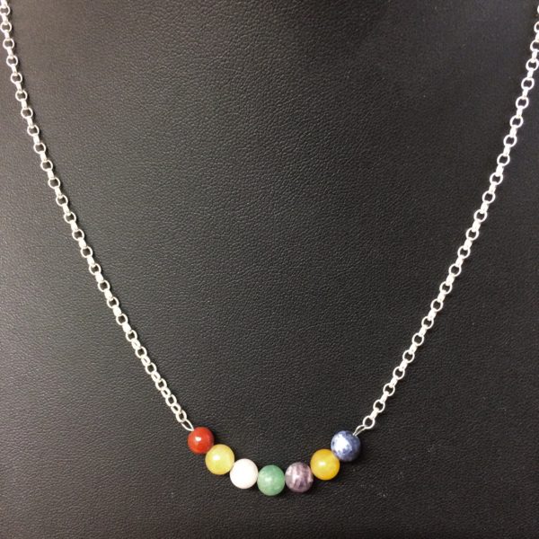 A necklace with 925 sterling silver chain and 6mm gemstone beads in the order of the colours of the rainbow song