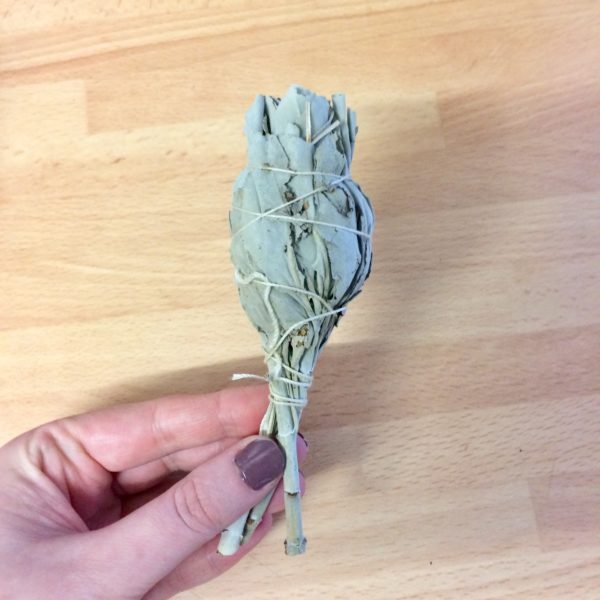 Sage smudging stick made with natural white sage and tied with thin twine