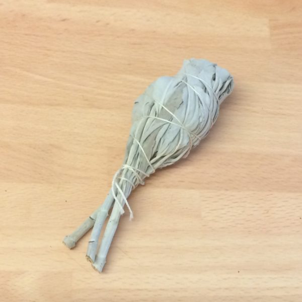 Sage smudging stick made with natural white sage and tied with thin twine