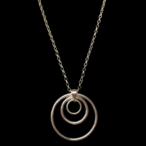 Triple Circle of Karma sterling silver handmade necklace on a black background