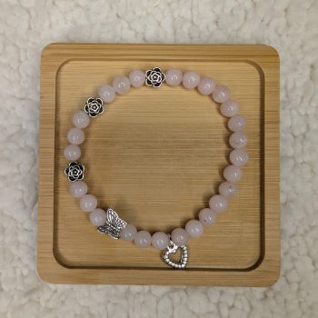 6mm Rose Quartz bracelet with 3 silver flower beads, 1 butterfly bead and a heart charm