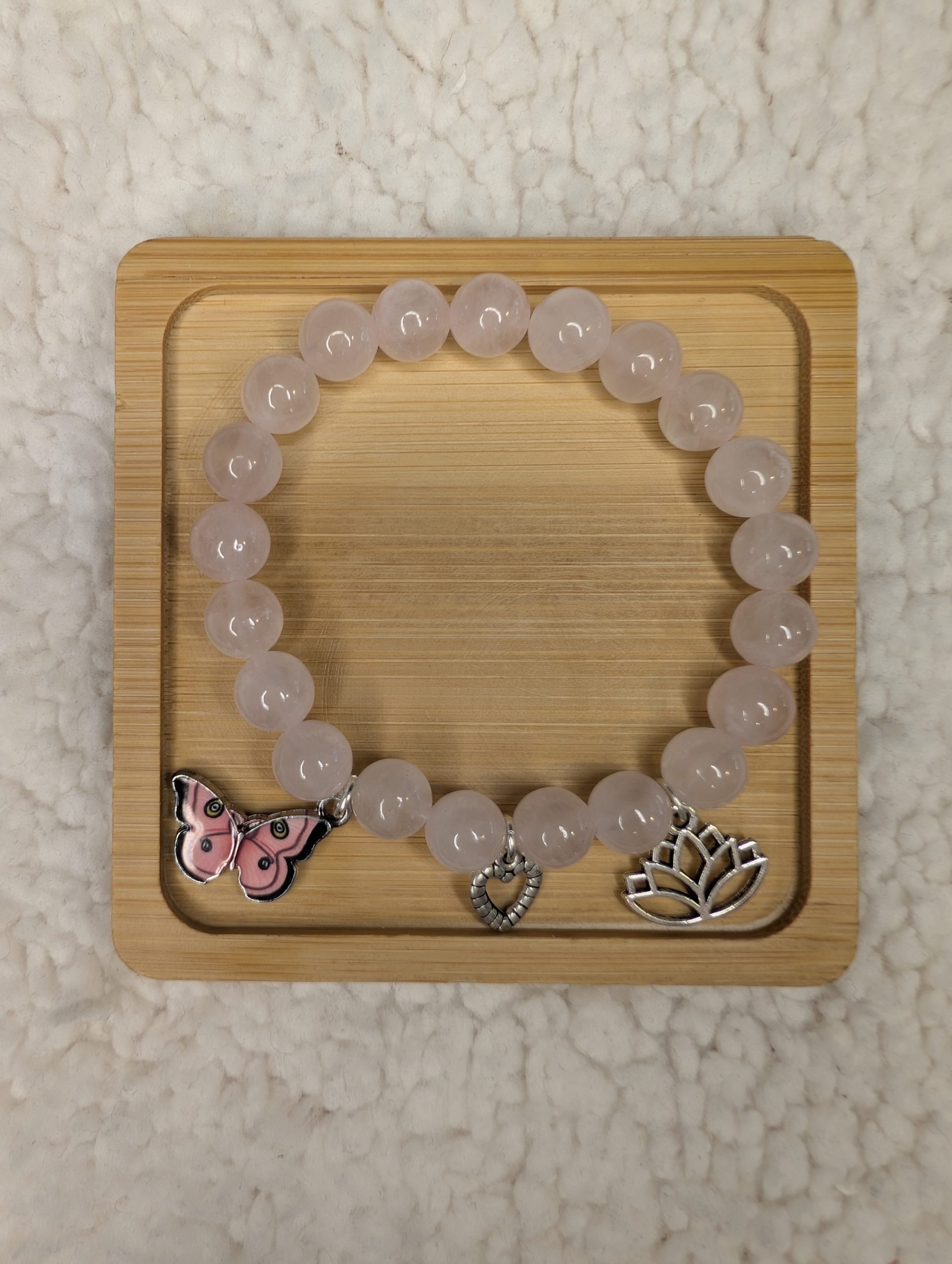 8mm Rose Quartz bracelet with three dangling charms
