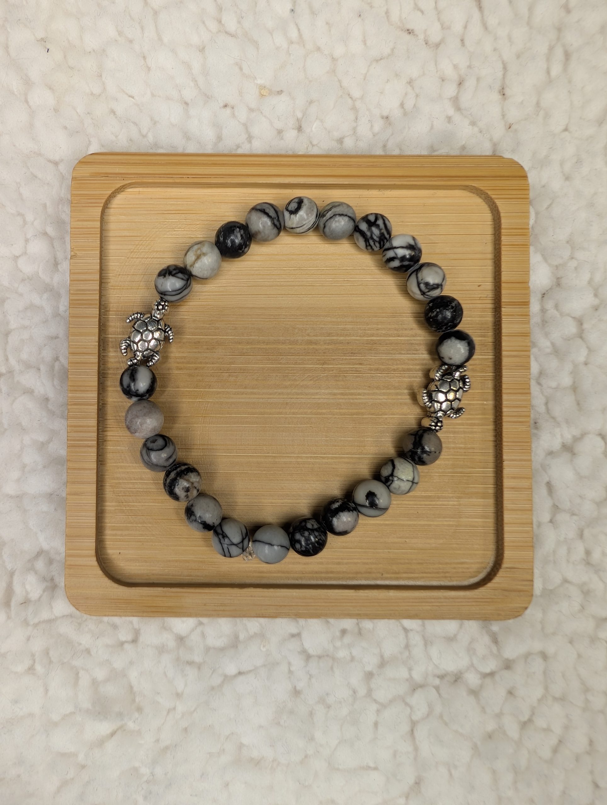 Net Jasper bracelet with two silver turtle beads