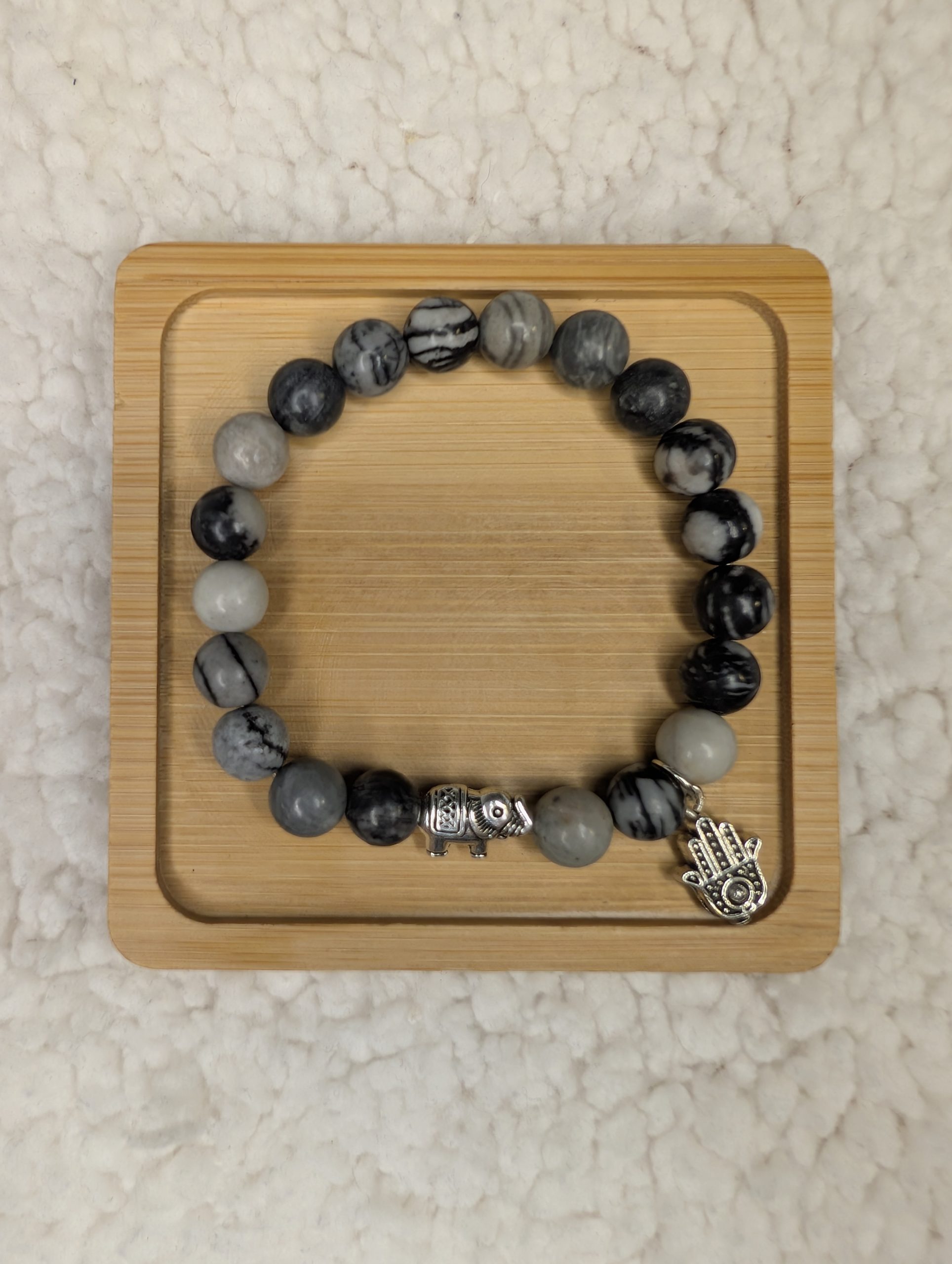 Net Jasper bracelet with silver elephant bead and hand of fatima charm