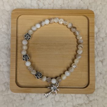 Mother of Pearl bracelet with three flower beads and a palm tree charm